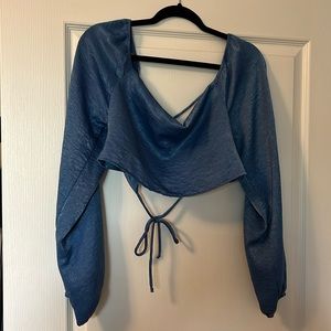 Blue long sleeve top with open back and ties